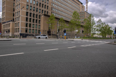 Road by buildings in city