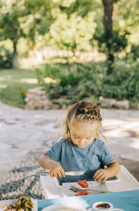 Girl sitting on table