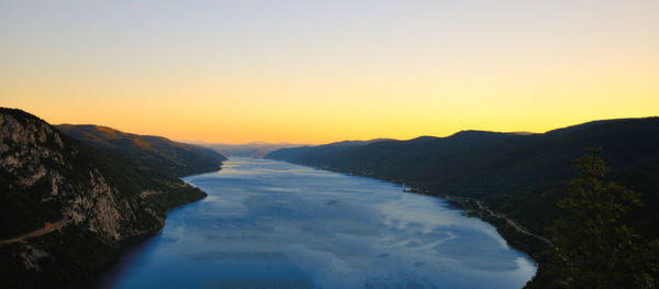 Scenic view of mountains against sky at sunset