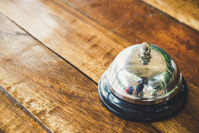 High angle view of glass on wooden table