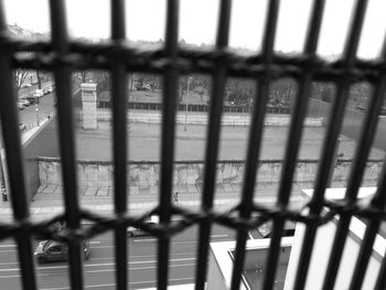 Close-up of metal fence against sky