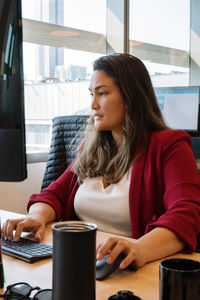 Woman working on a computer in the office