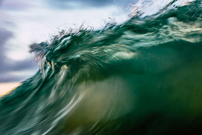 Close-up of sea wave against sky