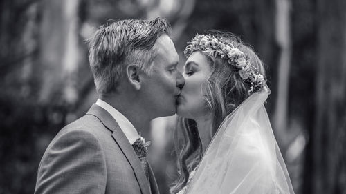 Close-up of couple kissing outdoors