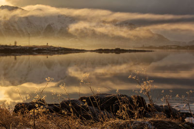 Scenic view of lake against sky during sunset