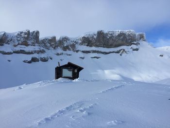 Snow covered mountain against sky