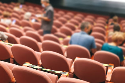 People taking seats while observing social distancing