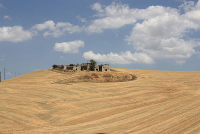 Scenic view of landscape against blue sky