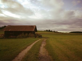 House on field against sky