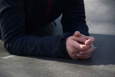 Low section of man sitting on floor