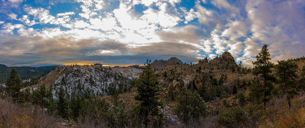 Scenic view of mountains against cloudy sky