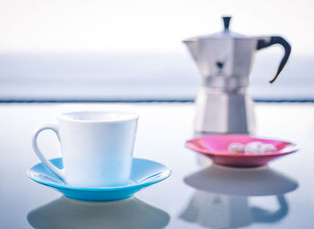 Close-up of coffee cup on table