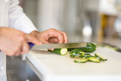 Close-up of chef preparing food