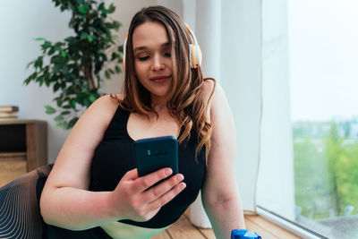 Young woman using mobile phone