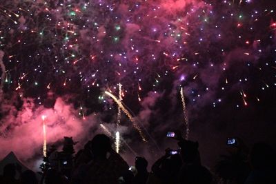 Firework display at night