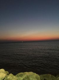 Scenic view of sea against clear sky during sunset