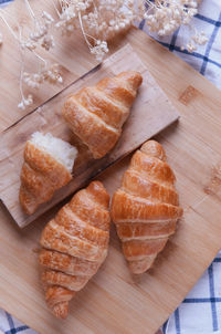 High angle view of bread on cutting board
