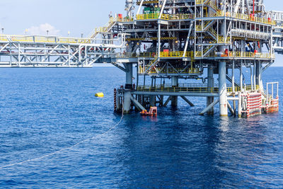Pier over sea against sky