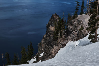 Scenic view of tree mountain against sky during winter