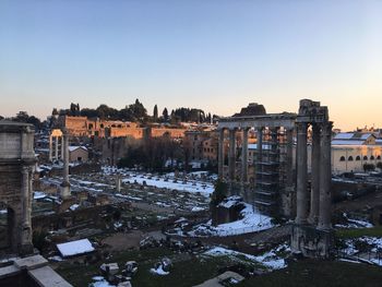 Abandoned city against clear sky during winter