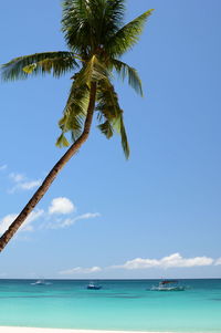 Scenic view of sea against blue sky