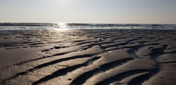 Scenic view of beach against clear sky