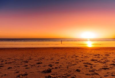 Scenic view of sea against clear sky during sunset