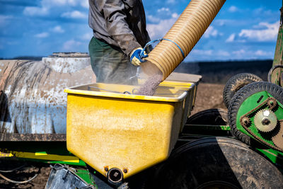 Low angle view of man working at construction site