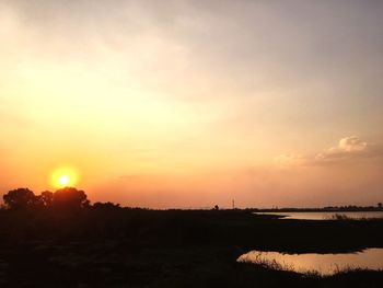 Scenic view of silhouette landscape against sky during sunset