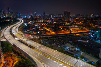 Ampang kuala lumpur elevated highway akleh with city skyline in malaysia at twilight