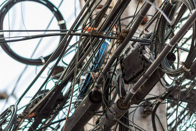 Low angle view of tangled wires