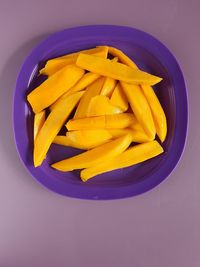 High angle view of yellow soup in bowl