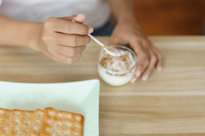 Midsection of man preparing food on table