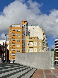 Buildings in city against sky