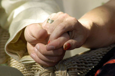 Cropped image of people holding hands