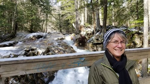 Portrait of a smiling young woman in snow