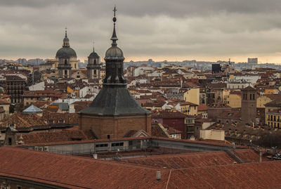 Aerial view of townscape against sky in city