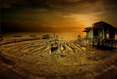 Scenic view of beach against sky during sunset