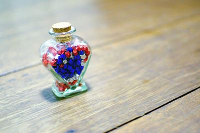 High angle view of multi colored glass on table