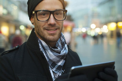Portrait of young man using smart phone