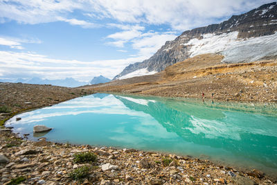 Perfect reflections in beautiful emerald coloured alpine lake