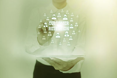 Close-up of man holding smart phone