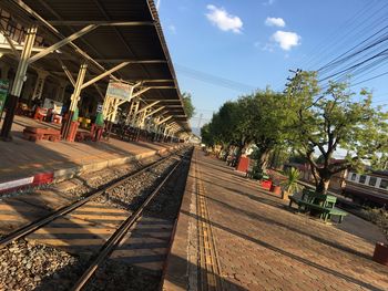 Train at railroad station against sky