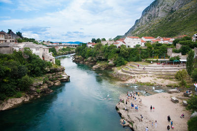 High angle view of river passing through city