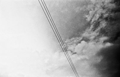 Low angle view of cables against sky