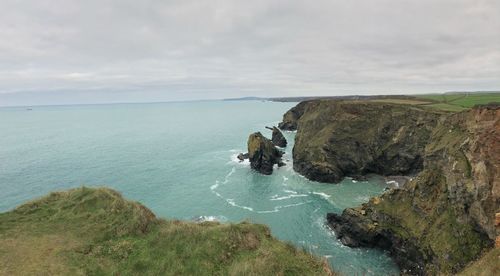 Scenic view of bay against sky