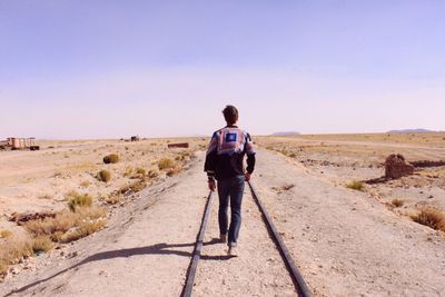 Full length of woman walking on landscape