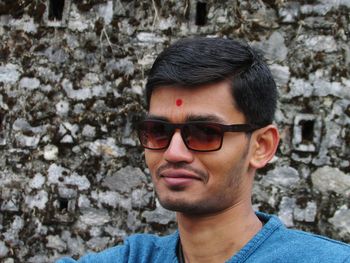 Portrait of young man wearing sunglasses