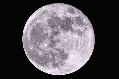 Low angle view of moon against clear sky at night