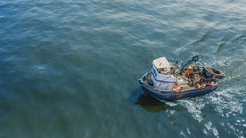 High angle view of boat sailing in sea